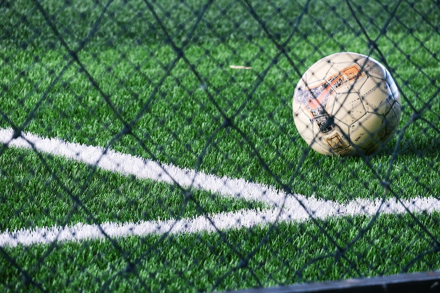 Soccer ball placed near court line