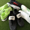 Four pairs of soccer boots in a circle