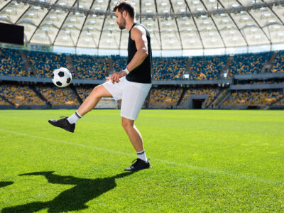 Bouncing soccer ball or football on leg