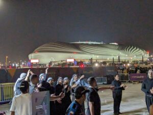 An Arab singing group performs outside Al Janoub Stadium at the FIFA World Cup