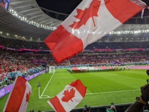 Canadian fans wave their flags in anticipation of their first World Cup match in Qatar