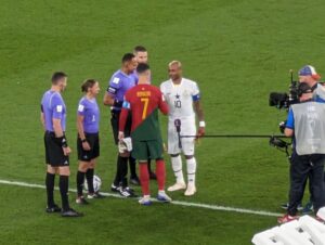 Captains meet for the coin toss before Portugal vs Ghana at the FIFA World Cup in Qatar